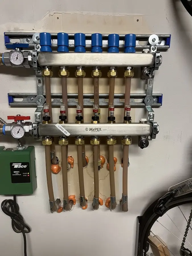 Plumber performing Leak Detection at a residential property in Goshen